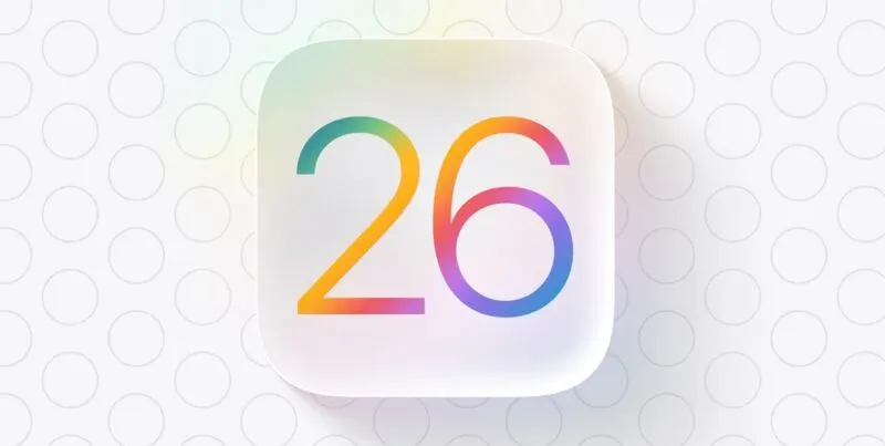 Rounded, glass-like app icon badge with the number 26 rendered in a rainbow gradient, echoing Apple’s iOS 26 branding
